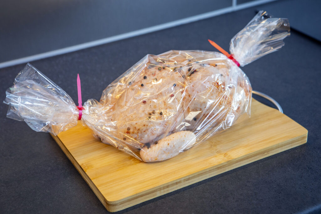 chicken-in-roasting-sleeve-with-red-clips